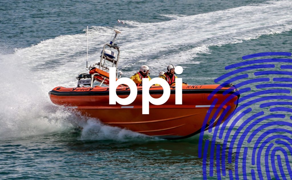 Coast guards in a boat at sea with the BPI logo and an illustration of a fingerprint in the foreground